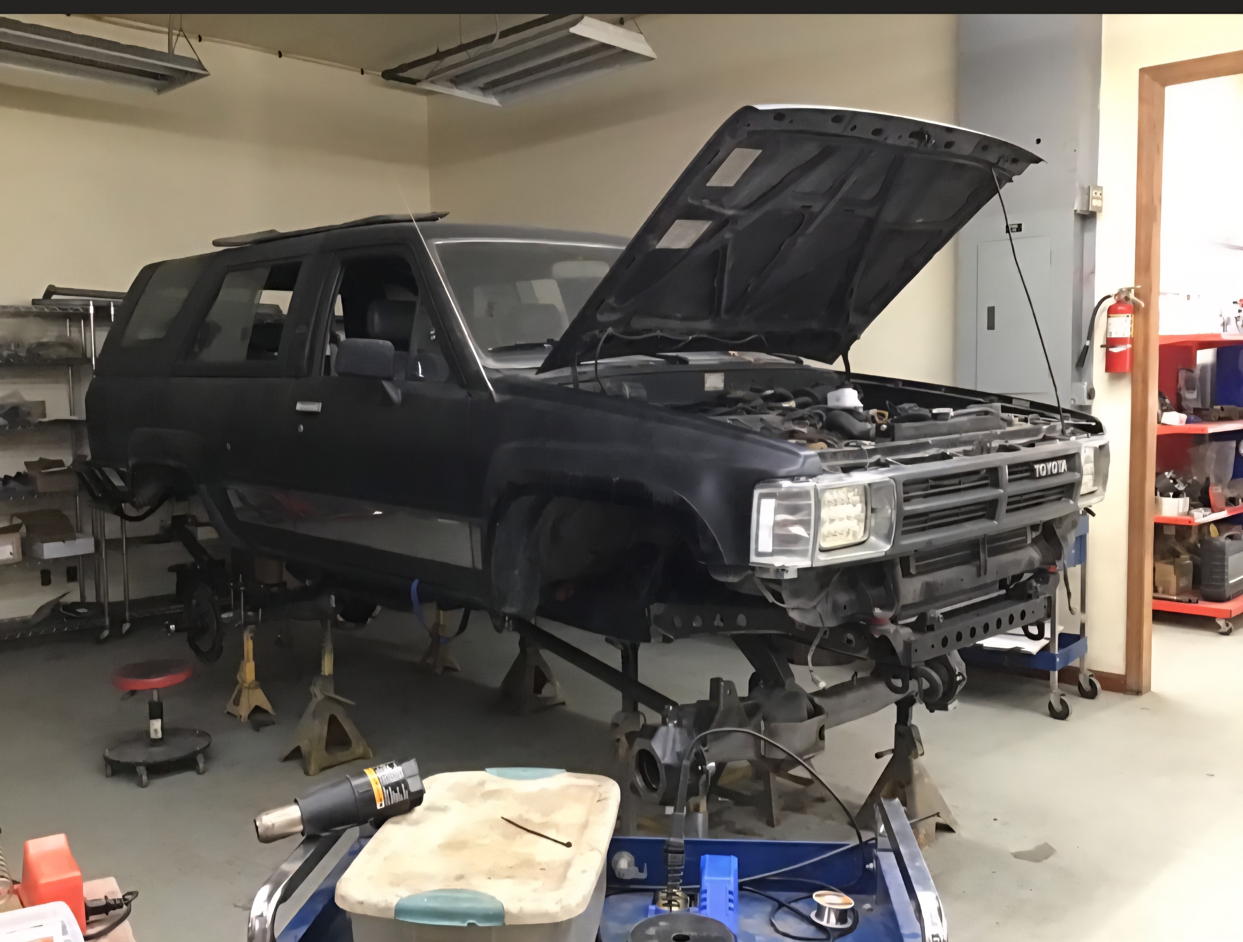Jacob’s 4Runner in the shop on jack stands during axle rebuild